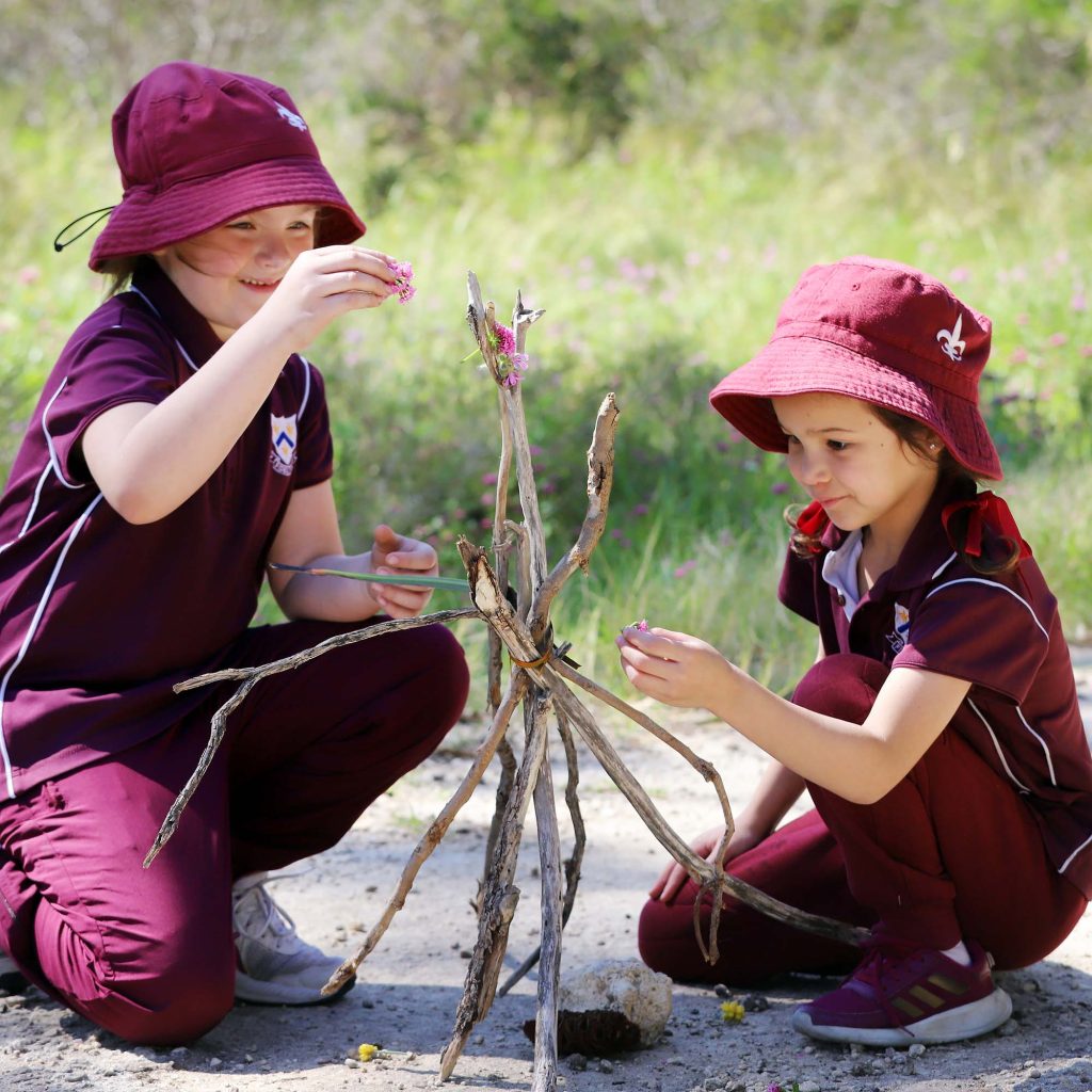St Mary's early learning centre students building with branches