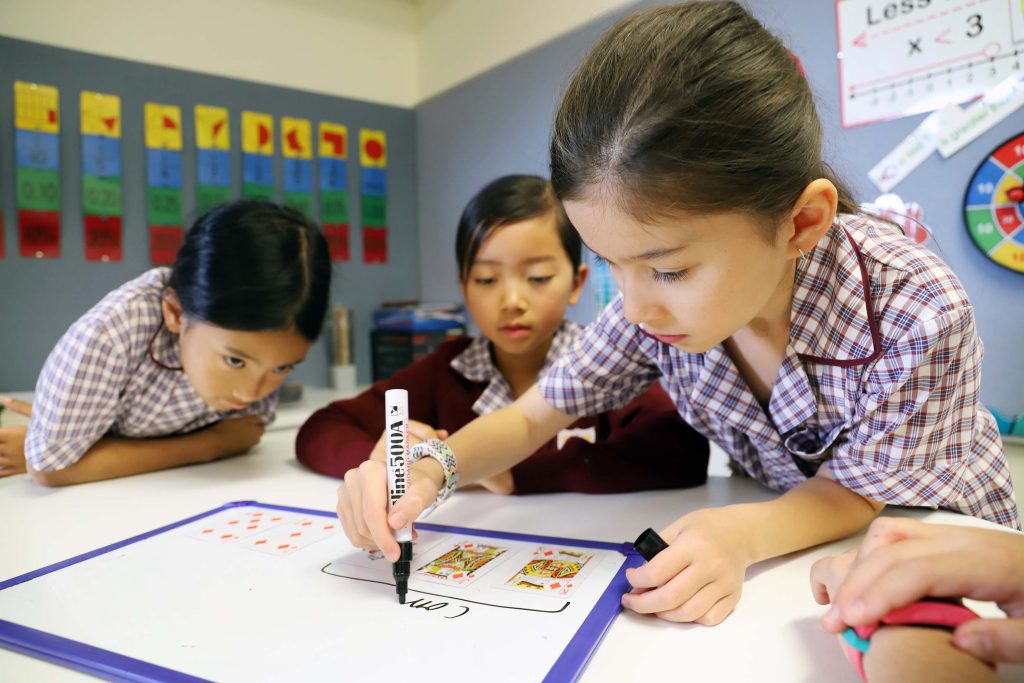 st mary's private junior school students drawing on whiteboard