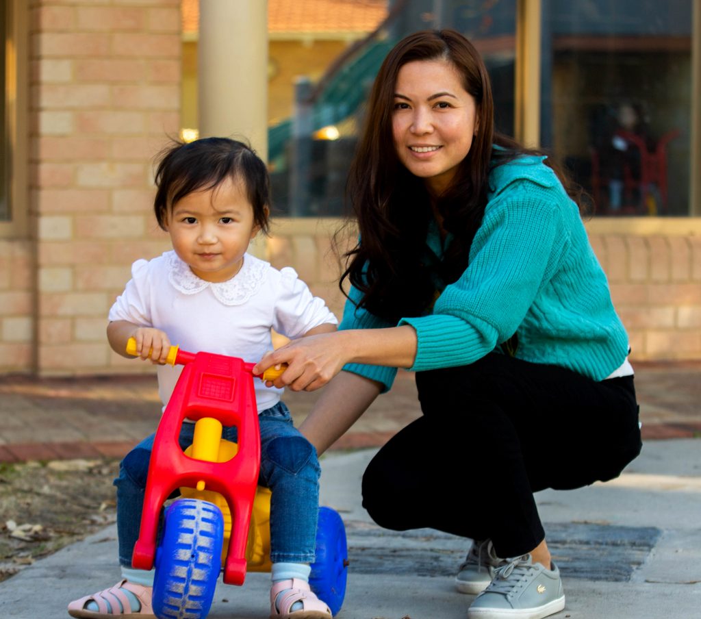 Playgroup child with early childhood teacher