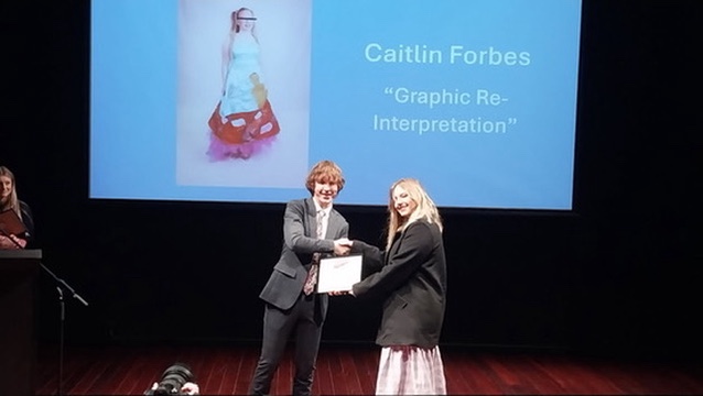 Sammi receiving her award. 